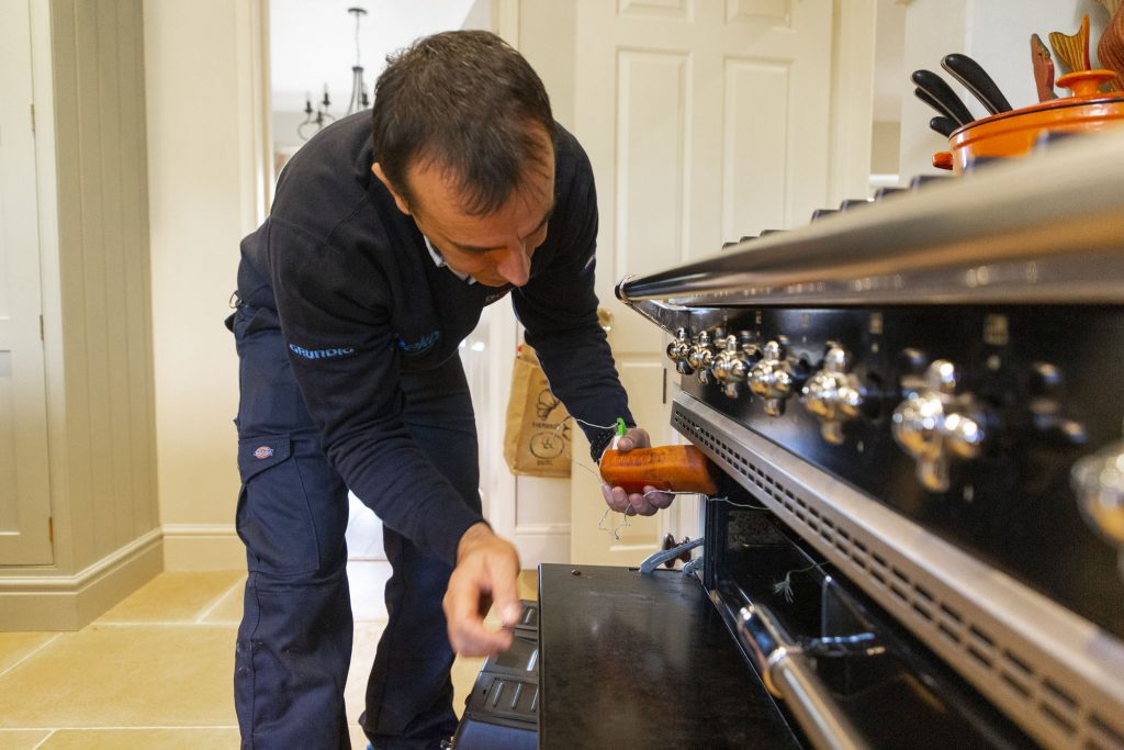 Domex engineer repairing oven in Barnet