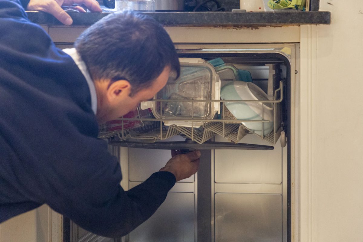 Domex engineer repairing dishwasher
